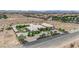Stunning aerial view of a large home with a landscaped yard in a desert community at 4455 W Ford Ave, Las Vegas, NV 89139