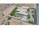 Desert property with a well-manicured lawn and a sparkling pool, as viewed from an aerial perspective at 4455 W Ford Ave, Las Vegas, NV 89139