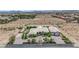 Stunning aerial view of a large home with a landscaped yard in a desert community at 4455 W Ford Ave, Las Vegas, NV 89139