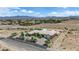 Stunning aerial view of a large home with a landscaped yard in a desert community at 4455 W Ford Ave, Las Vegas, NV 89139