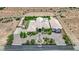 Stunning aerial view of a large home with a landscaped yard in a desert community at 4455 W Ford Ave, Las Vegas, NV 89139