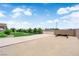 Expansive backyard with gravel area, lawn, and landscaping, enhanced by a beautiful blue sky at 4455 W Ford Ave, Las Vegas, NV 89139