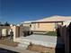 Backyard featuring artificial turf, patio, and concrete steps at 4455 W Ford Ave, Las Vegas, NV 89139