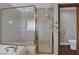 Upgraded bathroom featuring a frameless glass shower and tile accents at 4455 W Ford Ave, Las Vegas, NV 89139