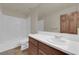 Bright bathroom featuring a white tub/shower combo and a single sink vanity at 4455 W Ford Ave, Las Vegas, NV 89139