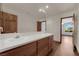 Spacious bathroom showcasing double sinks with a wood vanity and a large mirror above at 4455 W Ford Ave, Las Vegas, NV 89139