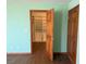 Bedroom with a closet featuring custom shelving and a wood door at 4455 W Ford Ave, Las Vegas, NV 89139
