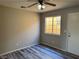 Bright bedroom with hard floors, neutral walls, and a sunny window at 4455 W Ford Ave, Las Vegas, NV 89139