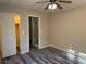 Bedroom with gray floors, neutral walls, and natural light from windows at 4455 W Ford Ave, Las Vegas, NV 89139