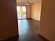 Bedroom with private patio entrance, ceiling fan, and wood-look floors at 4455 W Ford Ave, Las Vegas, NV 89139