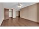 Bedroom with a ceiling fan, hardwood floors, closet and adjacent rooms at 4455 W Ford Ave, Las Vegas, NV 89139
