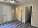 Bedroom featuring gray flooring, ceiling fan and two closets at 4455 W Ford Ave, Las Vegas, NV 89139