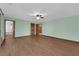 Large bedroom with tiled floors and multiple entry doors and archways at 4455 W Ford Ave, Las Vegas, NV 89139