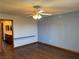 Bedroom with wood floors, ceiling fan, and a bathroom at 4455 W Ford Ave, Las Vegas, NV 89139