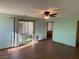 Bedroom with a sliding door to the backyard and hard surface floors at 4455 W Ford Ave, Las Vegas, NV 89139