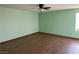 Bedroom with wood flooring, ceiling fan, and neutral color paint at 4455 W Ford Ave, Las Vegas, NV 89139