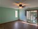 Bedroom featuring a sliding glass door to the yard and laminate flooring at 4455 W Ford Ave, Las Vegas, NV 89139