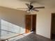 Bright bedroom featuring tile floors, a ceiling fan, and a closet at 4455 W Ford Ave, Las Vegas, NV 89139
