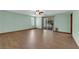 Spacious bedroom with wood floors and sliding glass doors to the backyard at 4455 W Ford Ave, Las Vegas, NV 89139