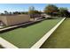 Bocce ball court with artificial turf and a clear blue sky at 4455 W Ford Ave, Las Vegas, NV 89139