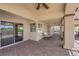 Covered patio with a sliding glass door, outdoor seating, paver flooring, and ceiling fans at 4455 W Ford Ave, Las Vegas, NV 89139