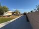 Long driveway and landscaped front yard of home on a sunny day at 4455 W Ford Ave, Las Vegas, NV 89139