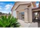 Home exterior with garage, desert landscaping, and brick walkway at 4455 W Ford Ave, Las Vegas, NV 89139