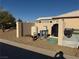 Exterior features of home include gravel, well equipment and block wall at 4455 W Ford Ave, Las Vegas, NV 89139