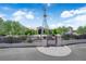 Gated entry to a well-maintained property with desert landscaping and mature trees at 4455 W Ford Ave, Las Vegas, NV 89139