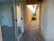 Exterior view of a paved walkway adjacent to sliding glass door and an air conditioner unit at 4455 W Ford Ave, Las Vegas, NV 89139