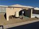 Exterior features of home include gravel, well equipment and block wall at 4455 W Ford Ave, Las Vegas, NV 89139