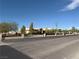 Spacious single story home featuring a circular driveway, desert landscaping, and a brick perimeter fence at 4455 W Ford Ave, Las Vegas, NV 89139