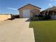 Property showcasing attached garage, easy-to-maintain turf, and desert landscaping at 4455 W Ford Ave, Las Vegas, NV 89139