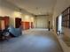 Spacious garage featuring an overhead door, open layout, and natural light from the windows, perfect for various uses at 4455 W Ford Ave, Las Vegas, NV 89139