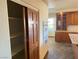 Pantry with shelves and a kitchen featuring custom cabinets and modern appliances at 4455 W Ford Ave, Las Vegas, NV 89139