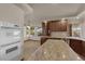 Spacious kitchen features wood cabinets, granite countertops and stainless steel appliances at 4455 W Ford Ave, Las Vegas, NV 89139