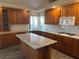 Spacious kitchen featuring granite countertops and an island with custom cabinetry at 4455 W Ford Ave, Las Vegas, NV 89139