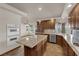 The kitchen features granite countertops, wood cabinets, tile floors and stainless steel appliances at 4455 W Ford Ave, Las Vegas, NV 89139