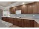 Updated kitchen features granite countertops, wood cabinets and stainless steel appliances at 4455 W Ford Ave, Las Vegas, NV 89139