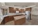 Spacious kitchen features wood cabinets, granite countertops and stainless steel appliances at 4455 W Ford Ave, Las Vegas, NV 89139