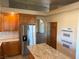 Modern kitchen featuring a central island, stainless appliances, and granite counters at 4455 W Ford Ave, Las Vegas, NV 89139