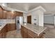 Updated kitchen has wood cabinets, granite countertops and stainless steel appliances at 4455 W Ford Ave, Las Vegas, NV 89139