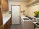 Laundry room featuring cabinets, washer and dryer at 4455 W Ford Ave, Las Vegas, NV 89139