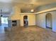 Spacious living room boasts a fireplace, ceiling fan, recessed lighting, and tile floors at 4455 W Ford Ave, Las Vegas, NV 89139