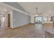 Open living area with tile floors, ceiling fan, and sliding glass doors leading to the outdoor space at 4455 W Ford Ave, Las Vegas, NV 89139