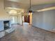 Inviting living space with a fireplace, tile floors, and entry to a separate room with shelving at 4455 W Ford Ave, Las Vegas, NV 89139