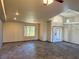 Spacious living room with high ceilings, tile floors, and a front door entrance at 4455 W Ford Ave, Las Vegas, NV 89139