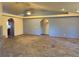 Bright and airy living room features a ceiling fan, tile floors, recessed lights and gray accent walls at 4455 W Ford Ave, Las Vegas, NV 89139