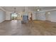 Spacious living room with tile flooring, large windows, and modern ceiling fans at 4455 W Ford Ave, Las Vegas, NV 89139