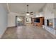 Inviting living room boasts a fireplace, entertainment center, and sliding glass doors to the patio at 4455 W Ford Ave, Las Vegas, NV 89139